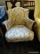 (R4) LADIES ARM CHAIR; HAS A BONNET STYLE TOP, FLORAL UPHOLSTERY EMBROIDERED EDGES, SWIRL CARVED