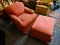 (R2) STANFORD FURNITURE CO RED ARMCHAIR AND OTTOMAN SET; PILLOW BACK DESIGN WITH SLOPING PLEATED