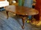(R2) OVAL SHAPED QUEEN ANNE STYLE COFFEE TABLE; SERIAL # ON UNDERSIDE IS 3220-01, WHICH MATCHES THIS