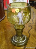 (R2) LARGE GLASS GOBLET; LARGE GREEN HAND PAINTED GLASS GOBLET WITH IMAGE OF A MAN WITH A WALKING