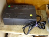 (R3) APC BATTERY BACKUP PLUS SURGE PROTECTION; BOX IS BLACK IN COLOR AND MEASURES ABOUT 11 IN LONG.