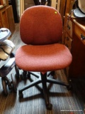 (R3) ROLLING OFFICE CHAIR; IS MAROON IN COLOR WITH BLACK BASE. MEASURES 21 IN X 25 IN X 35 IN