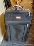(R4) FORECAST SUITCASE; GREEN IN COLOR WITH BROWN HANDLES AND BLACK TELESCOPING ROLLER HANDLE.