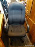 (R4) ROLLING OFFICE ARM CHAIR; BLACK IN COLOR WITH DIAMOND PATTERN UPHOLSTERY. MEASURES 25 IN X 28