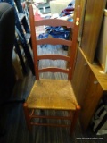 (R5) SIDE CHAIR; RED PAINTED WITH A RUSH BOTTOM SEAT. MEASURES 17 IN X 14 IN X 42 IN