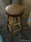 (R5) BARSTOOL; HAS A BROWN LEATHER SEAT AND OAK LEGS. MEASURES 14 IN X 14 IN X 29 IN