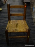 (R5) CHILDS CHAIR; SOLID OAK WOVEN SEAT CHILDS CHAIR. MEASURES 14 IN X 12 IN X 22 IN