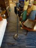 (R1) VINTAGE METAL FLOOR LAMP; HAS A PATINA FINISH AND ROUND BASE. MEASURES 47.5 IN TALL.