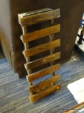 (R1) WOODEN WINE RACK; SLATTED BASE WITH DISPLAY OR STORAGE FOR 5 BOTTLES. MEASURES 10 IN X 24 IN.