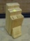 JEAN PATRIQUE KNIFE BLOCK; LIGHT WOOD SEVEN SLOT ANGLED KNIFE BLOCK. MEASURES 4 IN X 7 IN X 10 IN.