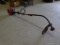 TROY BILT EDGER; GAS POWERED BLACK AND RED 25CC EDGER/WEED EATER. MODEL TB22EC. MEASURES 59 IN LONG.