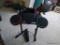 (BR4) GUITAR HERO DRUM KIT; BLACK WITH RED, YELLOW, GREEN, AND BLUE ACCENTS. MEASURES 27 IN WIDE AND