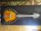 (LR) IBANEZ MANDOLIN; MODEL #M510-BS, SERIAL #2Y-02-GS110202630. 8 STRING, ROUND BODY WITH BROWN