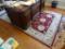 (OFC) BAKAR CLARET RUG; MAROON WITH TAN AND TAUPE BORDER AND CENTER FLORAL PATTERN. MEASURES 6.7 FT