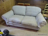 LOVESEAT; BLUE UPHOLSTERED, ROLLED ARMS, SITS ON 4 LEGS WITH CASTER WHEELS. DOES HAVE STAINING &