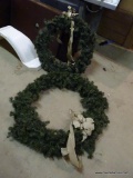 PAIR OF ARTIFICIAL WREATHS; TWO LARGE ROUND ARTIFICIAL PINE HOUSE WREATHS, EACH ONE HAS A GOLD BOW.
