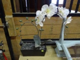 ARTIFICIAL ORCHID AND PLANTER; BLACK RECTANGULAR PLANTER WITH ARTIFICIAL WHITE ORCHID. MEASURES 9 IN