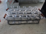 (BR4) VINTAGE GLASS BOTTLES IN WIRE BASKETS; 2 WOOD HANDLED WIRE BASKETS FILLED WITH 5 GLASS BOTTLES