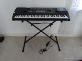 (BR1) CASIO KEYBOARD WITH STAND; MODEL #CTK-710. BLACK IN COLOR. 242 TONES: 113 PANEL TONES, 128