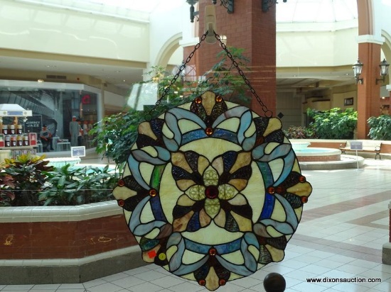 (WIN) HANGING STAINED GLASS-LIKE PIECE; LARGE, ROUND, MULTICOLORED WITH SHADES OF PALE YELLOW, BLUE,