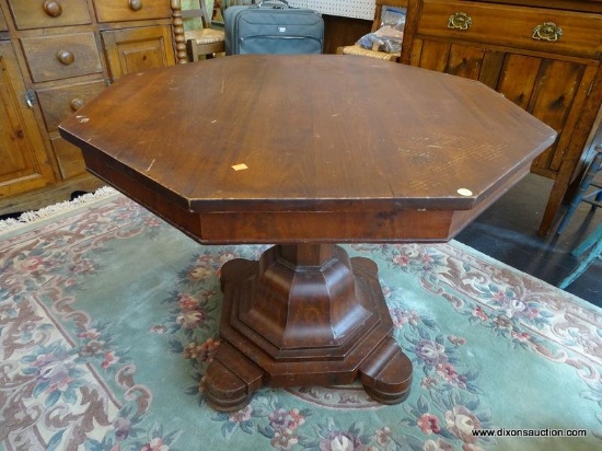 MAHOGANY PEDESTAL TABLE; OCTAGONAL SHAPE TOP SURFACE WITH MOLDED APRON, SITTING ON AN 8-SIDED