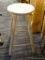 STOOL; VINTAGE STOOL WITH LOWER FOOTRESTS. MEASURES 14 IN X 30 IN