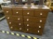 DRESSER; 10 DRAWER DRESSER WITH PORCELAIN KNOBS. MEASURES 42.5 IN X 15 IN X 32 IN
