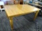 WOOD GRAIN DINING TABLE; RECTANGULAR TOP WITH AREA TO ADD A LEAF (NOT INCLUDED). SITS ON 4 TURNED