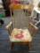 ROCKING CHAIR; MAPLE STRAIGHT BACK AND SPINDLE TURNED LEGGED ROCKING CHAIR. MEASURES 26 IN X 28 IN X
