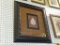 FRAMED LEAF PRINT; CREAM COLORED LEAF ON A BROWN BACKGROUND WITH A BLACK AND BROWN SHADOW BOX MAT.