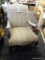 ARM CHAIR; HAS FLORAL STRIPED UPHOLSTERY AND MAHOGANY BONES. HAS ARM SLIPCOVERS. MEASURES 26 IN X 35