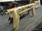 PAIR OF WOODEN SAWHORSES; EACH MEASURES 48 IN LONG AND 20 IN TALL.