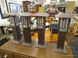 SET OF SOLAR LIGHTS; INCLUDES 4 TOTAL FREE STANDING SOLAR POWERED LIGHTS IN BRONZE TONED CASES.