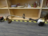 RYOBI WEEDEATER; GAS POWERED CREAM AND BLACK EDGE TRIMMER/WEEDEATER. 31CC 15 IN. MEASURES 54 IN.