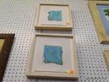 PAIR OF FRAMED WINE PRINTS; BOTH OF THESE PRINTS SHOW A GREEN VINE ON A BLUE BACKGROUND AND ARE ON A