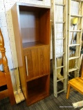 TALL WOODEN SHELVING UNIT; WOODGRAIN FINISH WITH OPEN UPPER AREA FOR SHELVES, A CENTER CABINET WITH