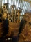 (SHED 1) METAL BARREL LOT; INCLUDES A LARGE OIL DRUM STYLE BARREL WITH CONTENTS OF HOES, RAKE,