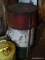 (SHED 3) OIL DRUM; VINTAGE METAL OIL/GREASE BARREL IN RED, WHITE, AND BLUE. MEASURES 15 IN X 27 IN