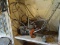 (SHED 3) WINCH; MANUAL CRANK TRAILER WINCH WITH LARGE ORANGE TOW HOOK. IS IN GOOD USED CONDITION AND