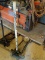 (SHED 3) FLOOR JACK; HAS A 1-1/2 TON LIFTING CAPACITY AND IS IN GOOD USED CONDITION.