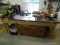 (WSHOP) WORKBENCH; SITS UPON 4 TREATED WOOD LEGS WITH THE TOP BEING MADE FROM AN OLD DOOR. IS IN