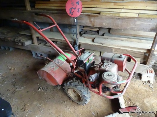 (OUT) BRIGGS & STRATTON TILLER; HAS 8 HP CAPABILITY AND AN I/C SERIES ENGINE. IS RED IN COLOR. IN