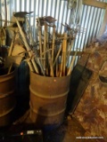 (SHED 1) METAL BARREL LOT; INCLUDES A LARGE OIL DRUM STYLE BARREL WITH CONTENTS OF HOES, RAKE,