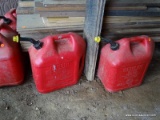 (SHED 2) 2 GAS CANS; BOTH ARE 5 GALLONS AND IN GOOD CONDITION!