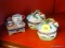 COLLECTIBLE PORCELAIN TRINKET BOX LOT; TOTAL OF 3 PIECES. 2 ARE MATCHING BASKETS OF TULIPS WITH