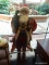 LIFE SIZED SANTA CLAUS FIGURINE; THIS PIECE IS A LARGE SANTA CLAUS HOLDING A SMALL TREE AND SEVERAL