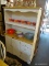 WHITE AND WOOD GRAIN KITCHEN HUTCH; TWO PIECE HUTCH WITH SCALLOPED TOP, MIDDLE SHELF WITH 4 HOLES ON