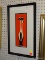 MID CENTURY MODERN CAT PRINT; THIS PRINT SHOWS A BLACK AND WHITE SIAMESE CAT ON AN ORANGE