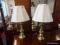SET OF BRASS TABLE LAMPS; SET OF 2 TABLE LAMPS WITH WHITE PLEATED BELL SHAPED SHADES SITTING ON