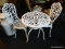 CAST IRON ICE CREAM PARLOR SET; INCLUDES 2 CHAIRS AND A TABLE. ALL ARE WHITE IN COLOR AND IN